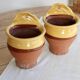 Pair of vintage wall planters in yellow glazed stoneware.