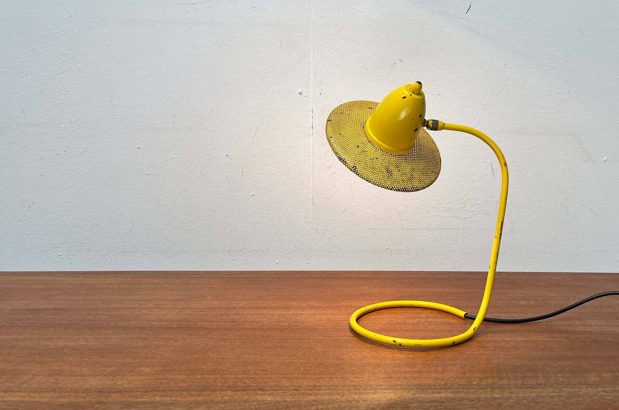 Perforated metal table lamp in Mid-Century Modern style, in the style of Mathieu Matégot, 1960s.