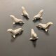 6 dolphin-shaped knife holders in silver-colored metal