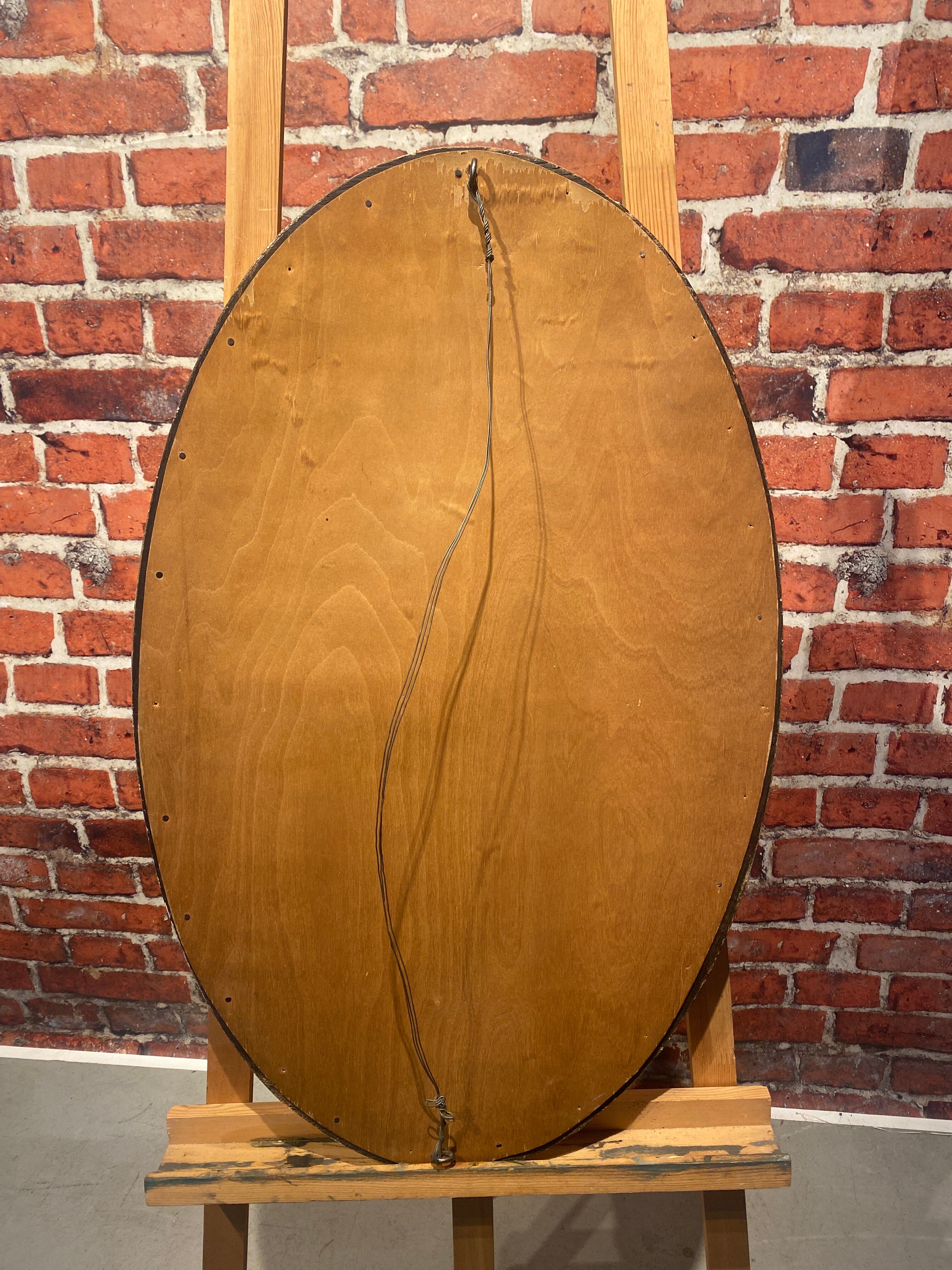 Oval mirror with wooden frame