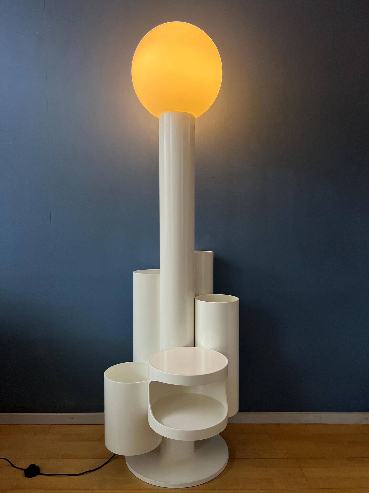 White floor lamp "Close Encounter" and plant stand by Kerst Koopman