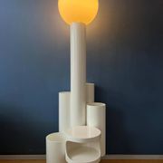 White floor lamp "Close Encounter" and plant stand by Kerst Koopman