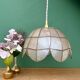 Vintage pendant light in mother-of-pearl and brass.