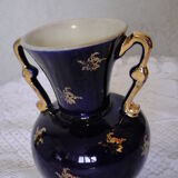 Revol porcelain vase, showcase object, romantic decor, blue background, golden handles