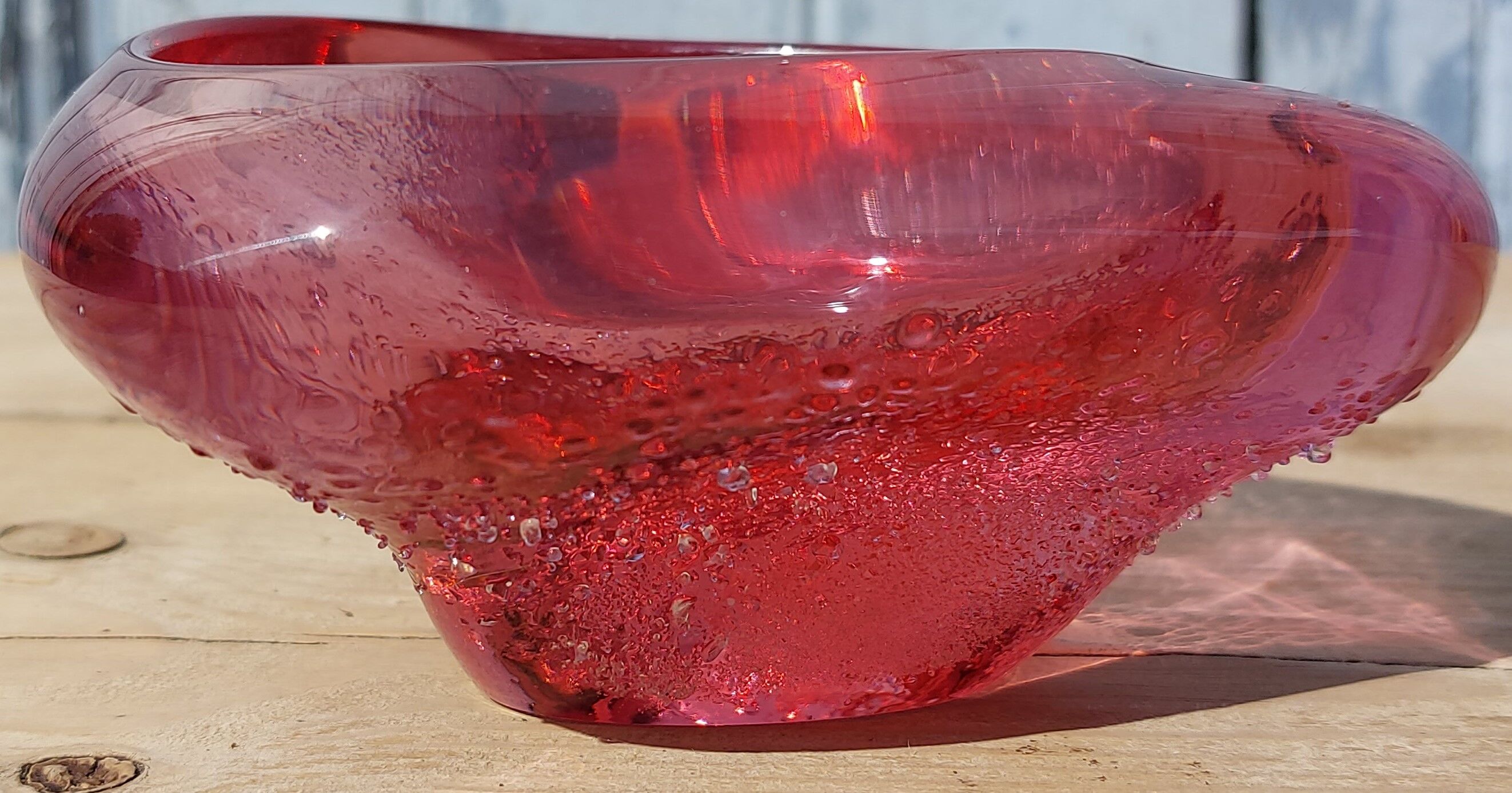 Empty pink blown glass pocket