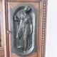 Large secretary with a drop-down front in carved oak, neo-Renaissance style.