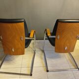 Chairs in leather, walnut and chrome