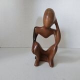 Wooden statuette sculpture of a thinking man design