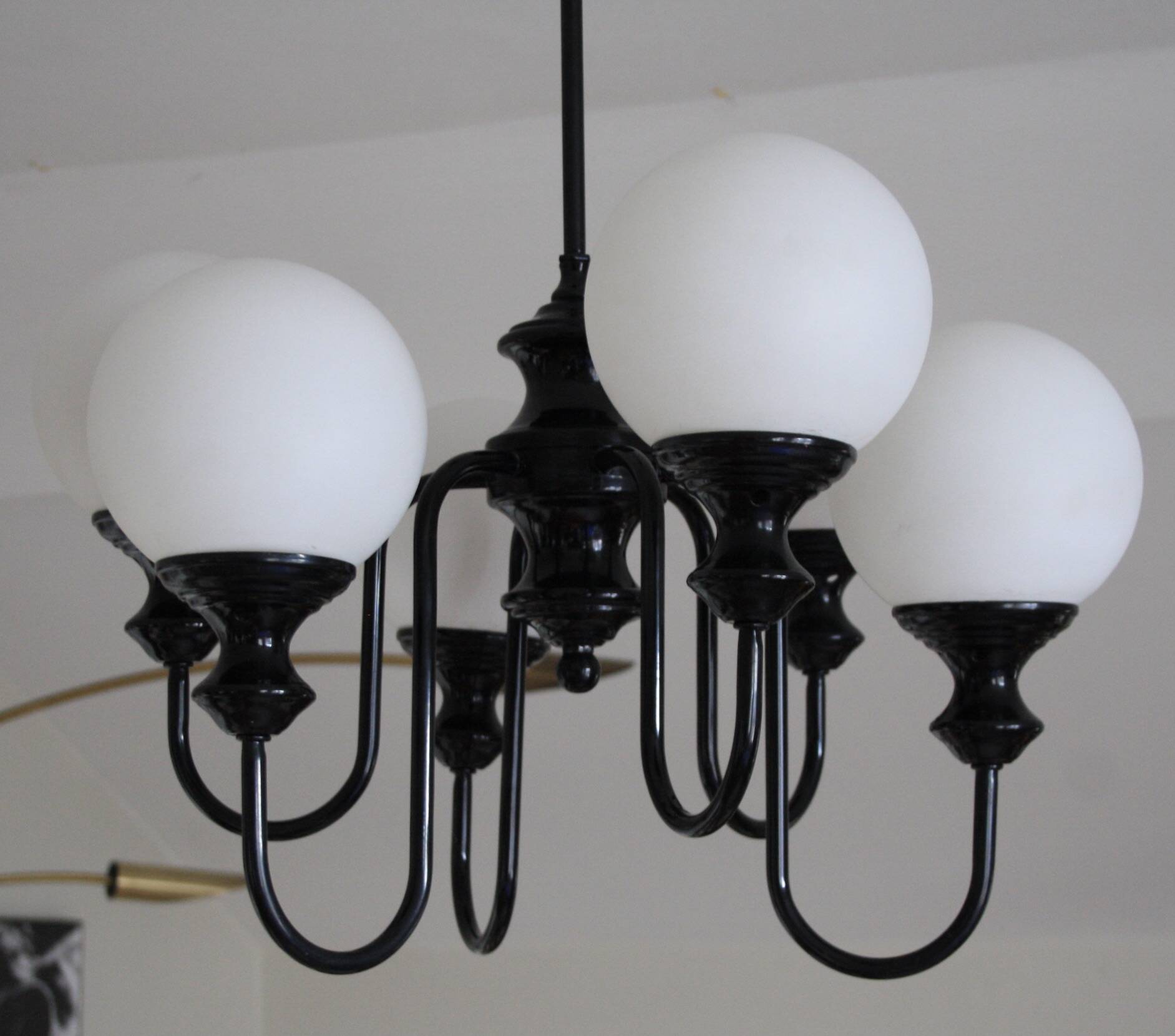 Metal chandelier and glass globes