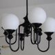 Metal chandelier and glass globes