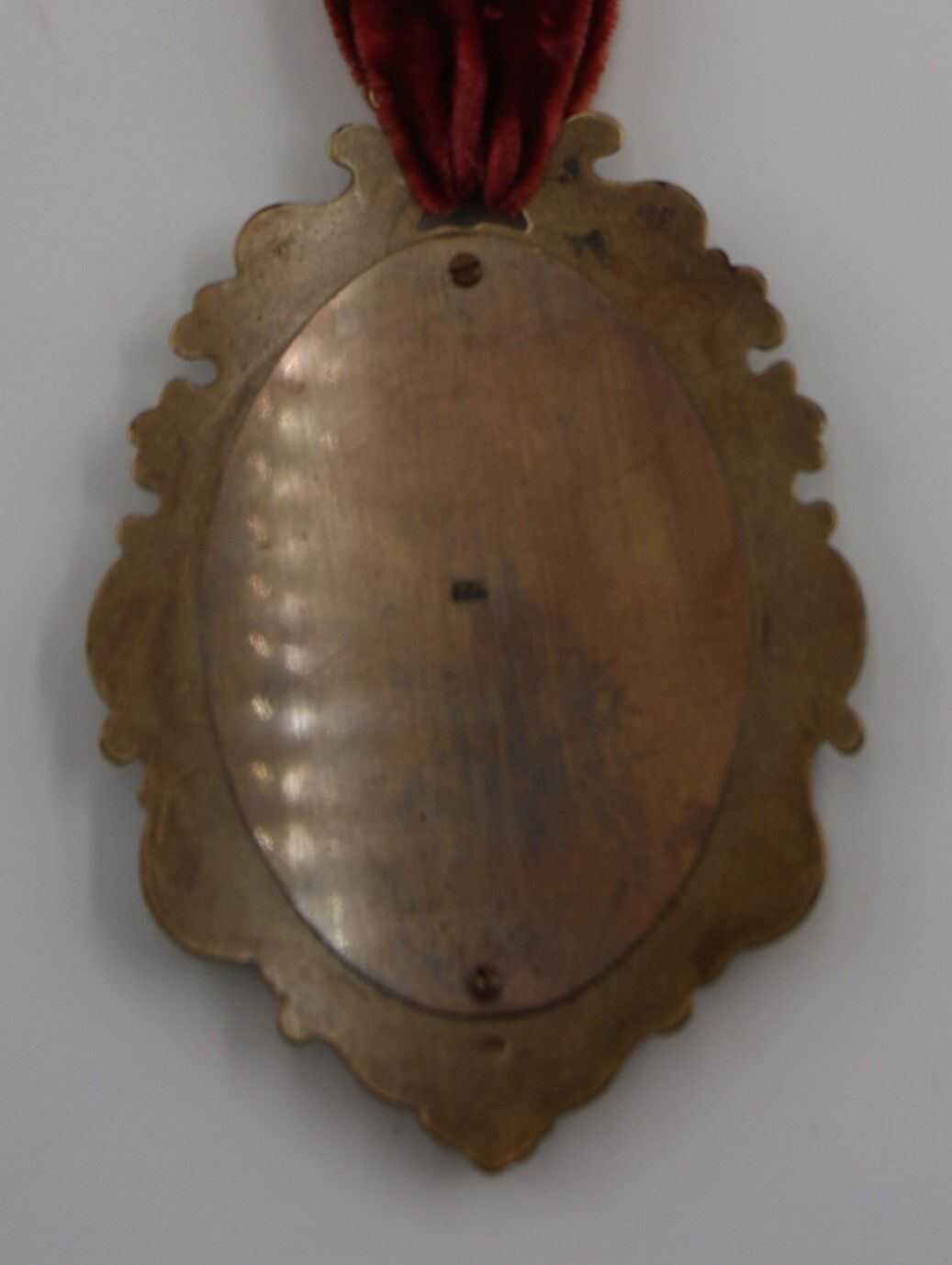 Vintage oval wall-mounted brass mirror