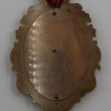 Vintage oval wall-mounted brass mirror