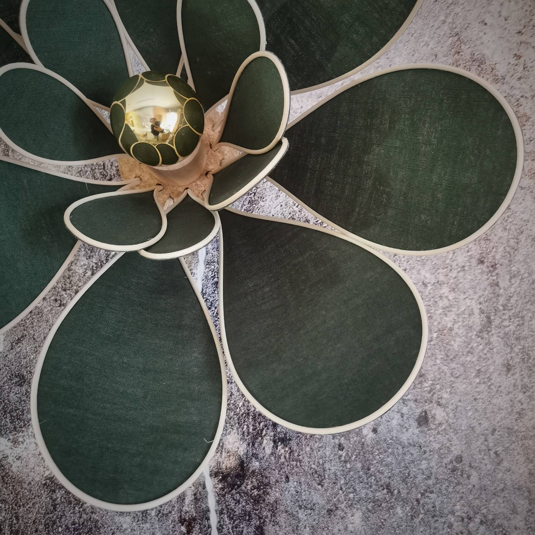 Flower wall light made of rattan and fir green linen petals