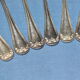 Old box of 12 small white metal spoons