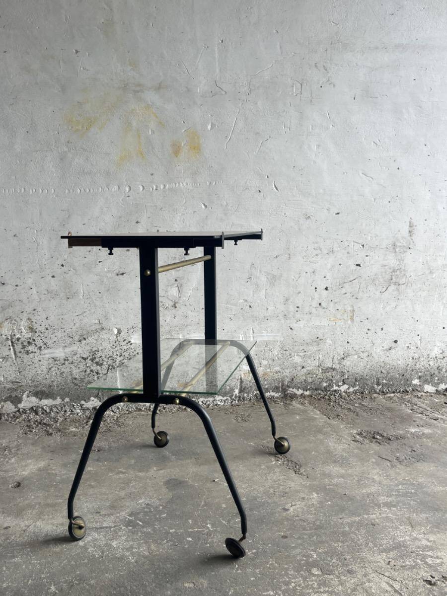 Black brass and glass mid-century trolley with sculptural legs — two-tier vintage bar cart