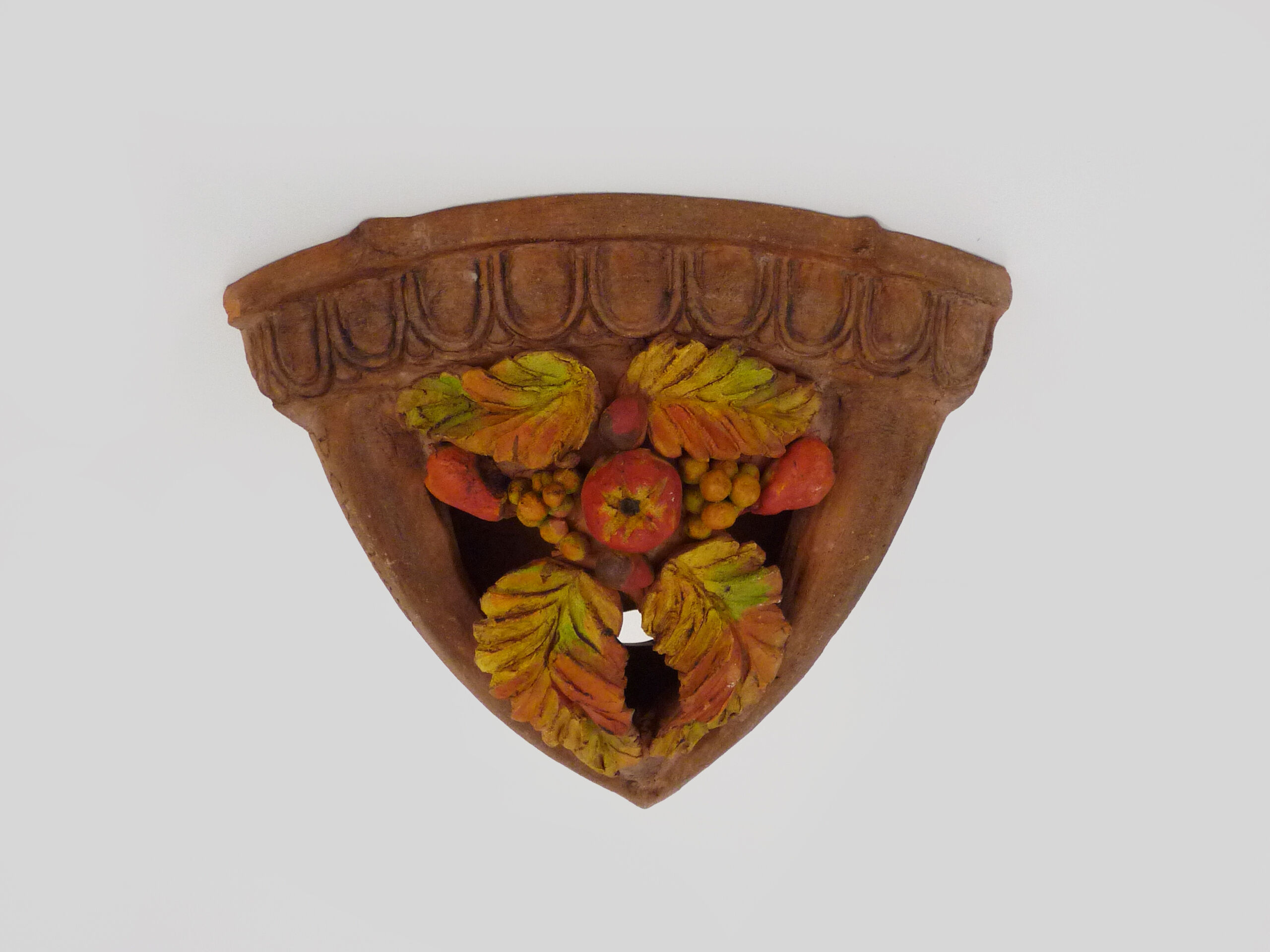 Corner wall lamp in terracotta with fruit decoration, signed D.Chadeau
