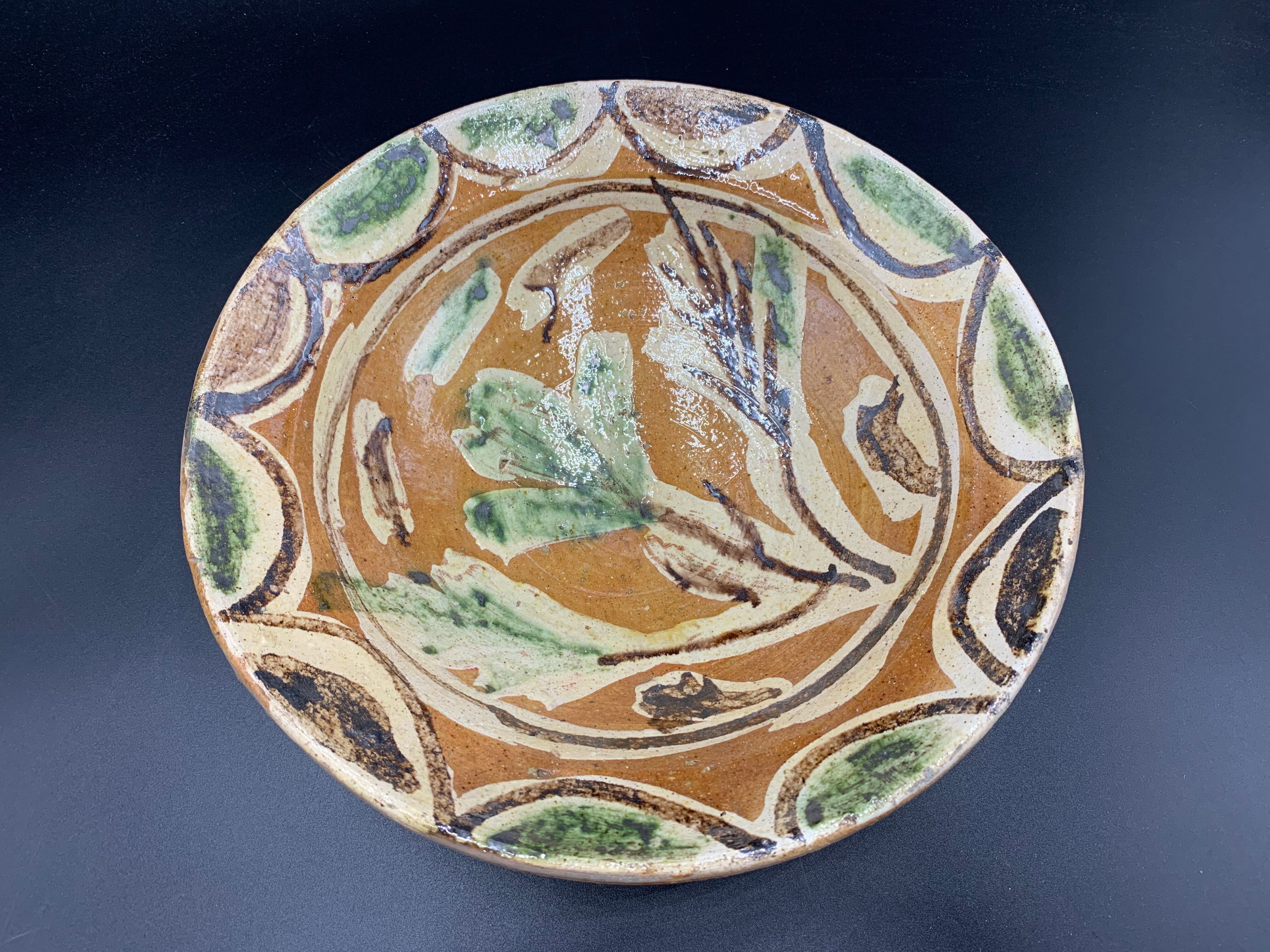 Ancient terracotta dish glazed with polychrome floral decoration, pakistan multan