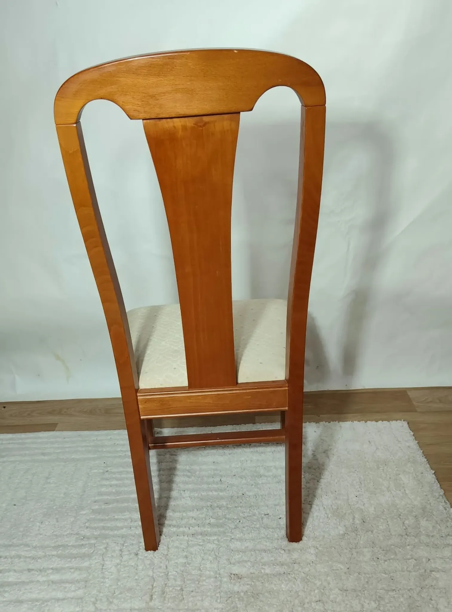Set of 4 vintage chairs in stained wood and cream fabric.