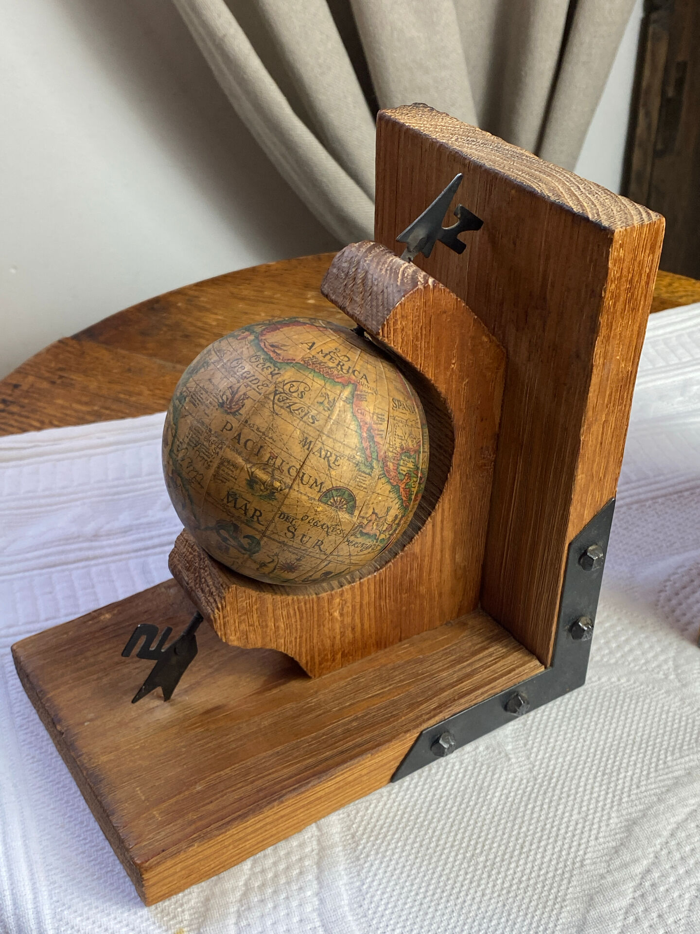 Pair of wooden bookends, rotating globes