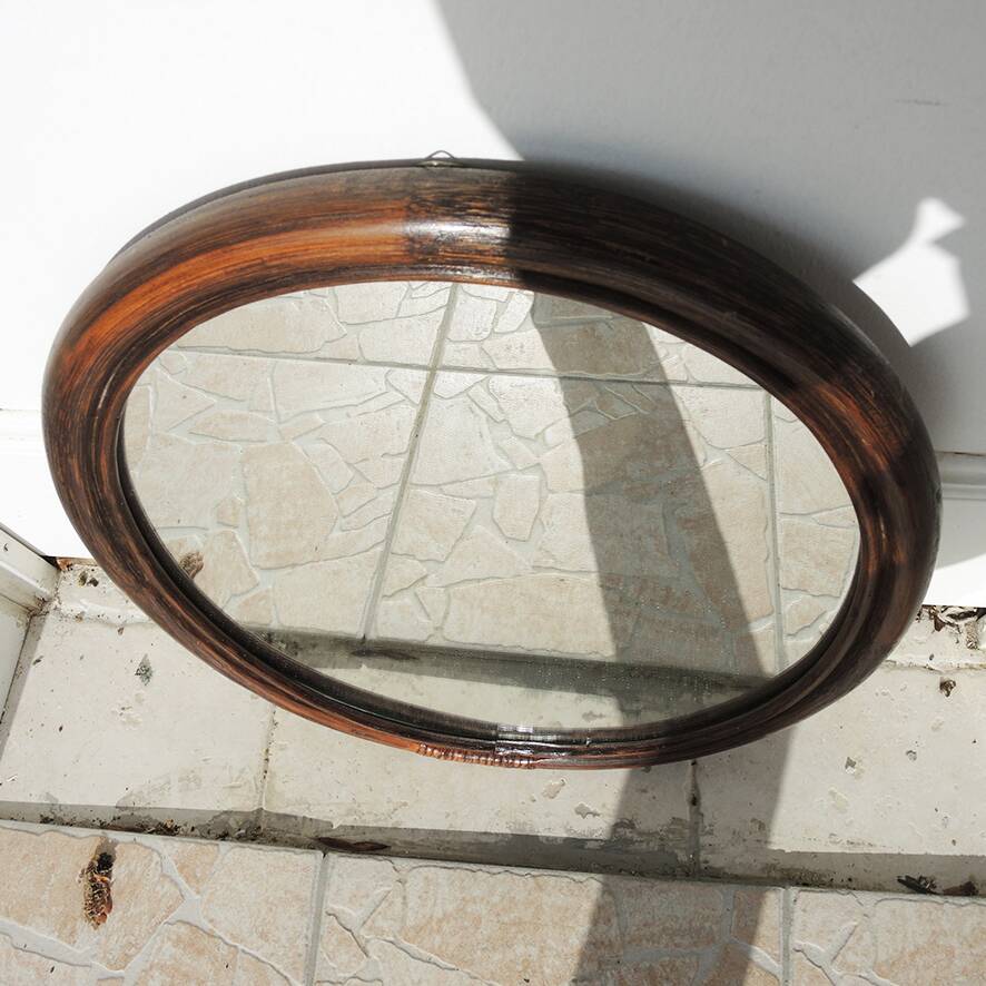 Vintage oval rattan mirror