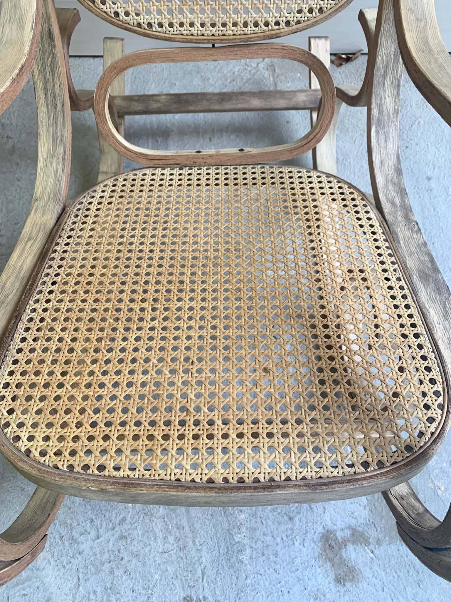 Rocking chair with a cane seat and backrest.