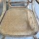 Rocking chair with a cane seat and backrest.