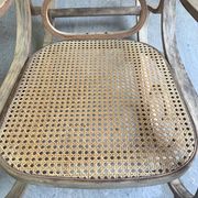 Rocking chair with a cane seat and backrest.