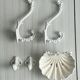 Bathroom décor, hooks, soap dish, white metal hangers.