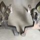 Pair of bronze fireplace firedogs with fleur-de-lys decor, art deco