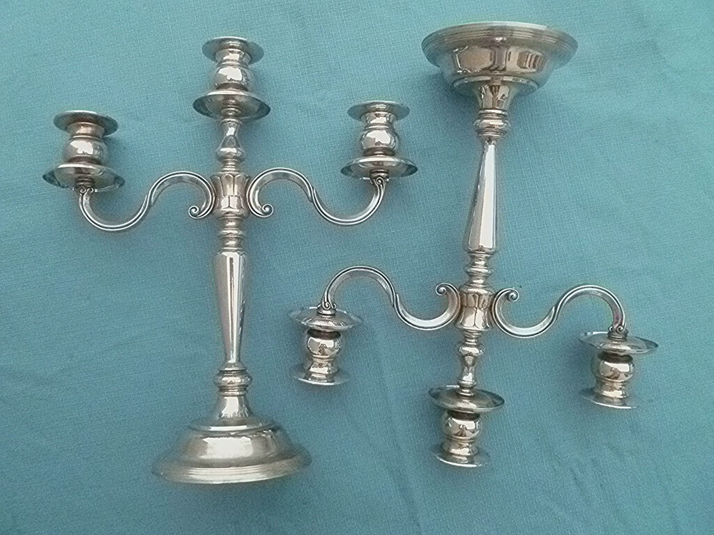 Pair of silver-colored metal candlesticks