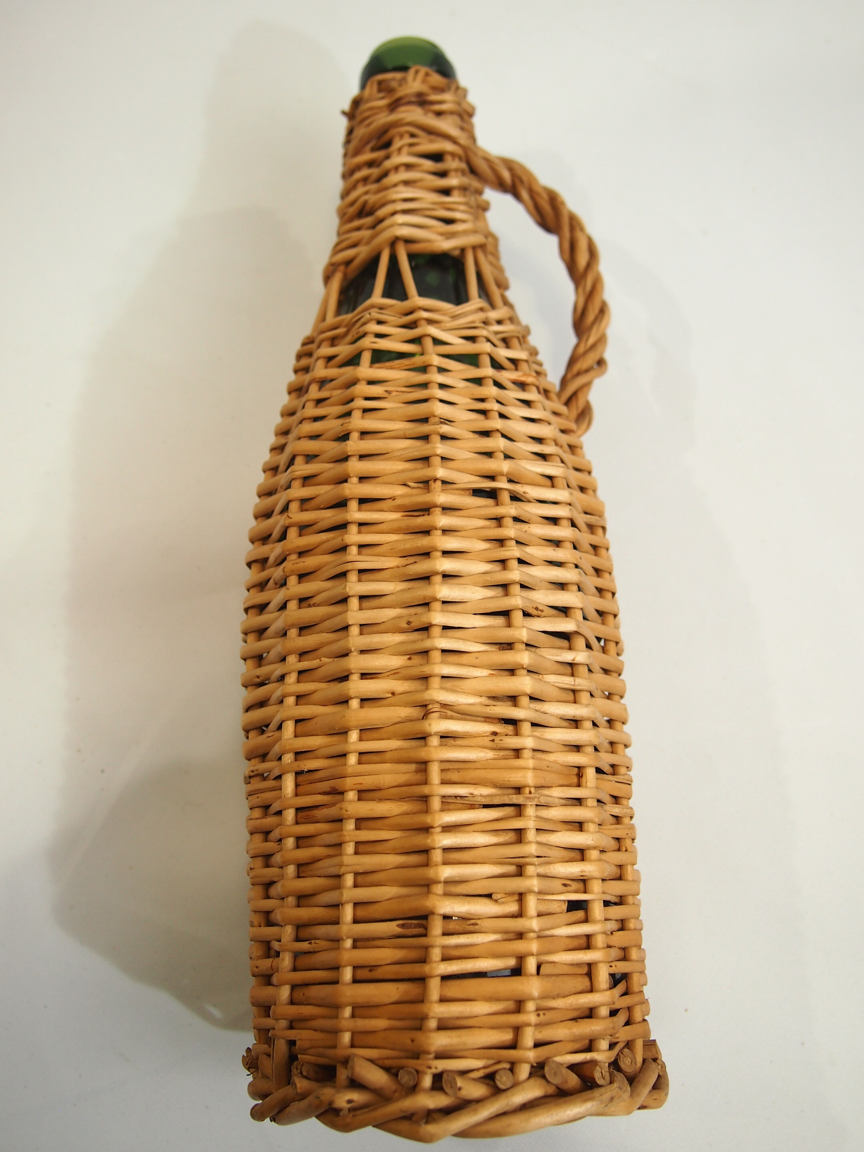 Bottle dressed in rattan