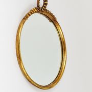 Round wall mirror in gilded wood, mid-century, C. Allodi & G. Subelli, Italy, 1950s.