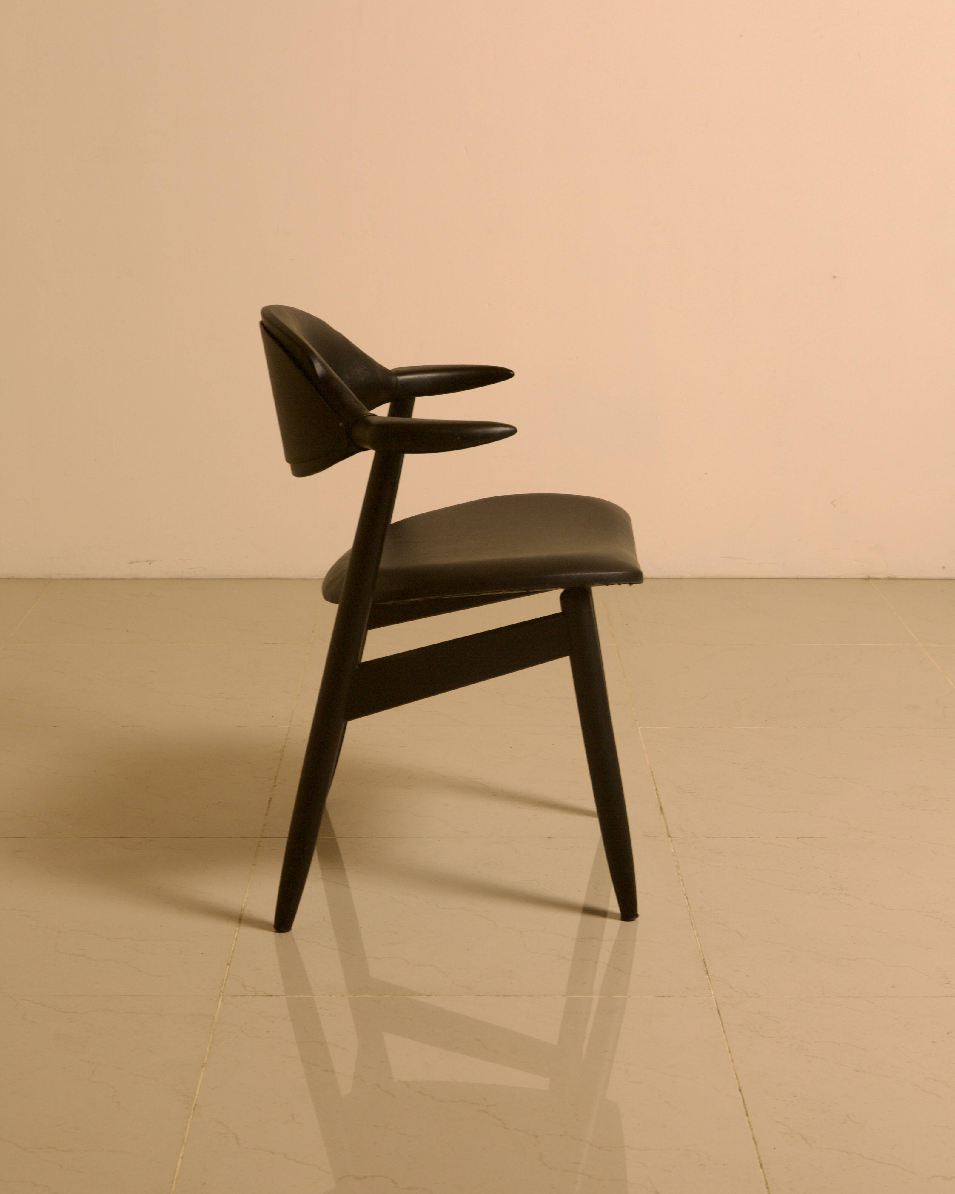 Dutch "Buffalo" armchair in wood and black leather from the 60s.