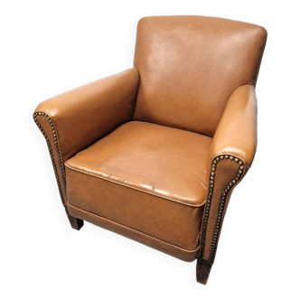 Vintage club chair from the 50s in imitation leather and wood