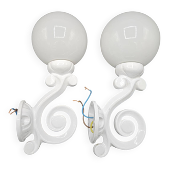Pair of white enameled cast iron wall sconces, mid-20th century