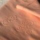Old linen and cotton sheet tinted coral