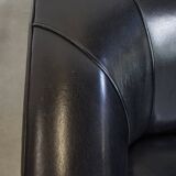 Very comfortable black Art Deco design armchair, made of sheepskin leather