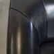 Very comfortable black Art Deco design armchair, made of sheepskin leather