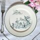 Old mismatched flat plates made of ironstone earthenware.
