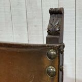 High-backed chair from the early 20th century in oak and leather