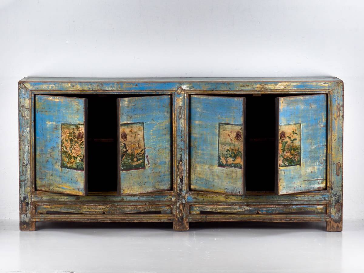 Old wooden entrance buffet in blue and yellow tones (circa 1920).
