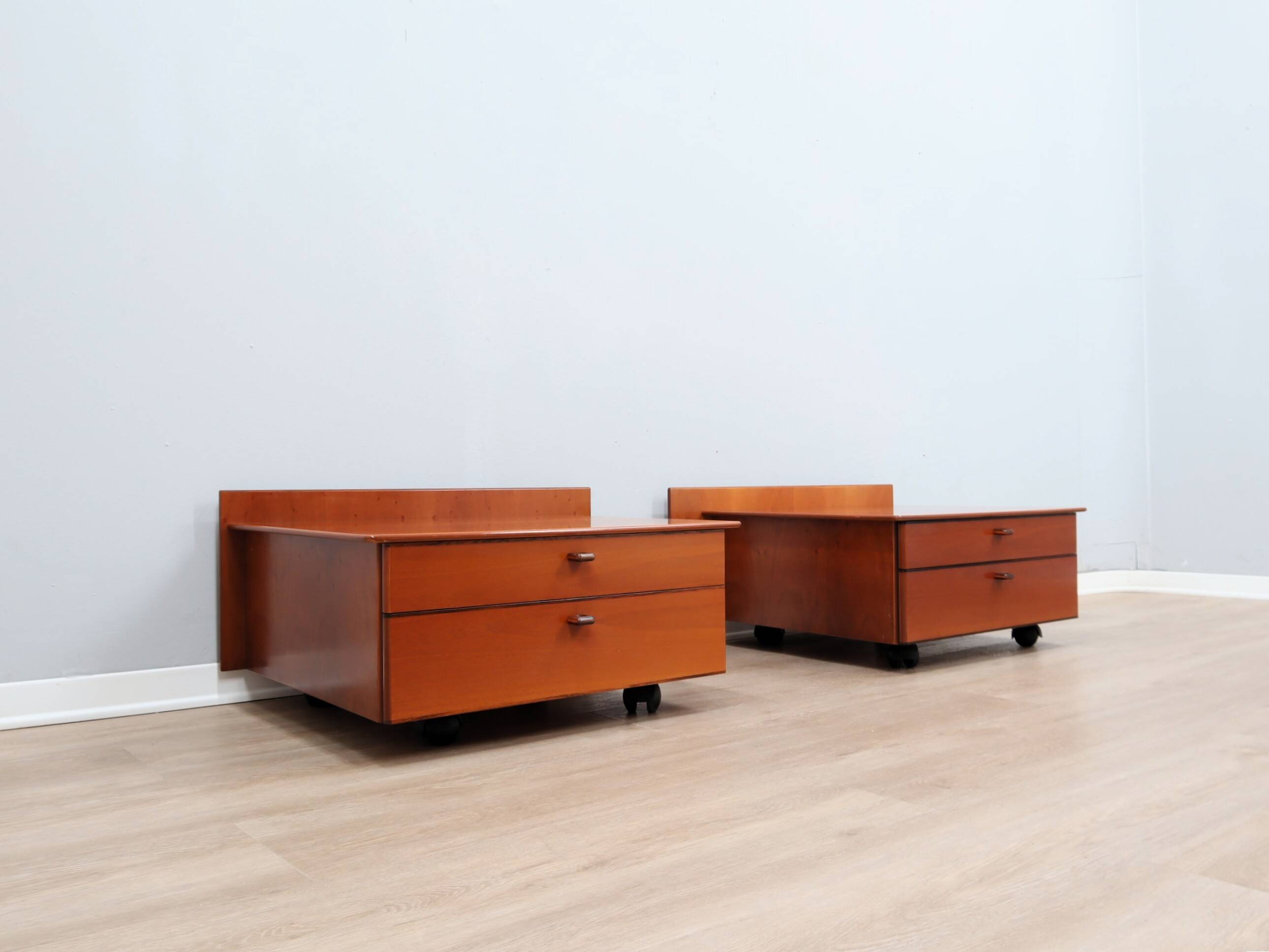 Pair of Stildomus walnut bedside tables with wheels 1970s
