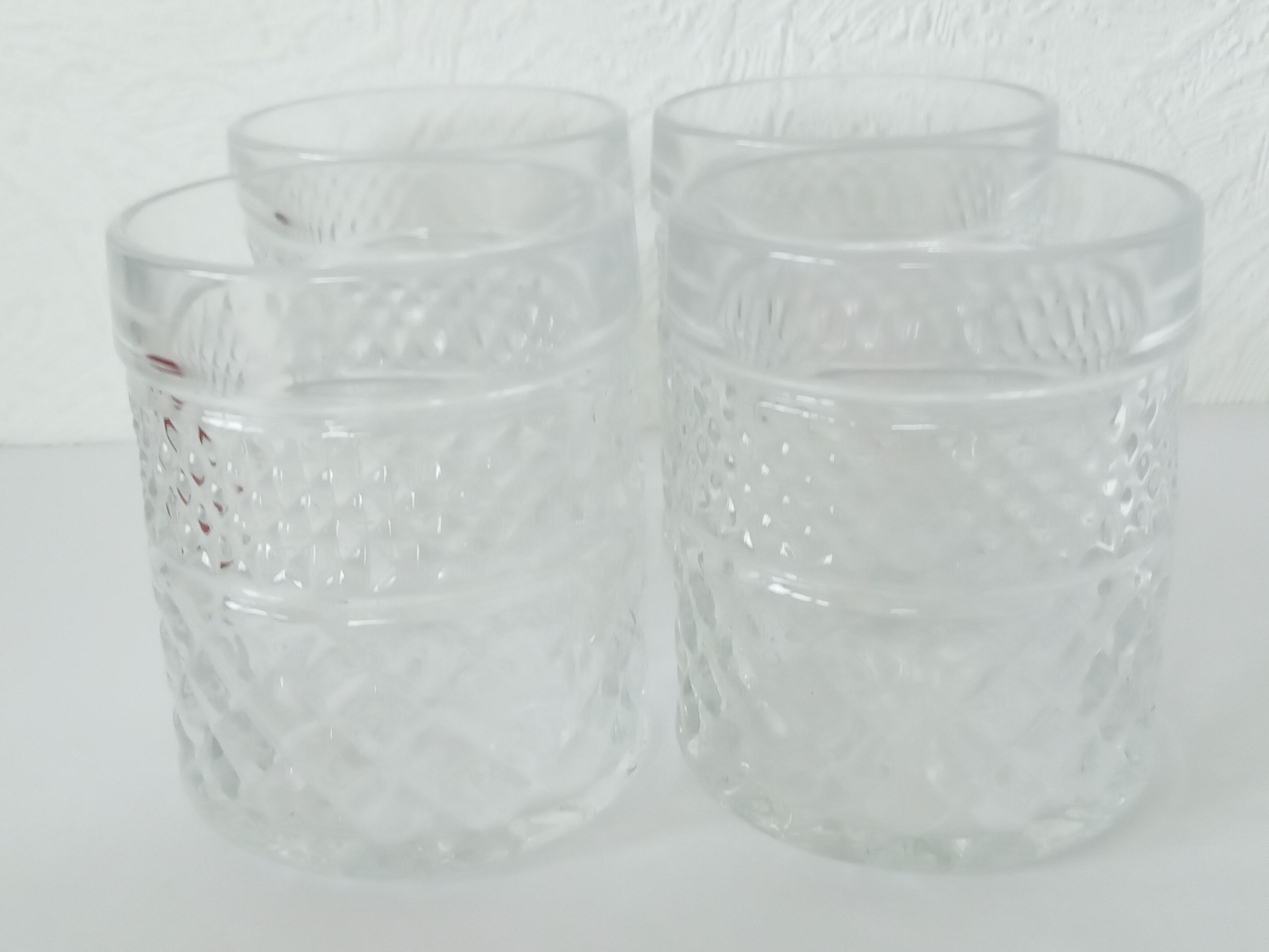 Four whiskey glasses