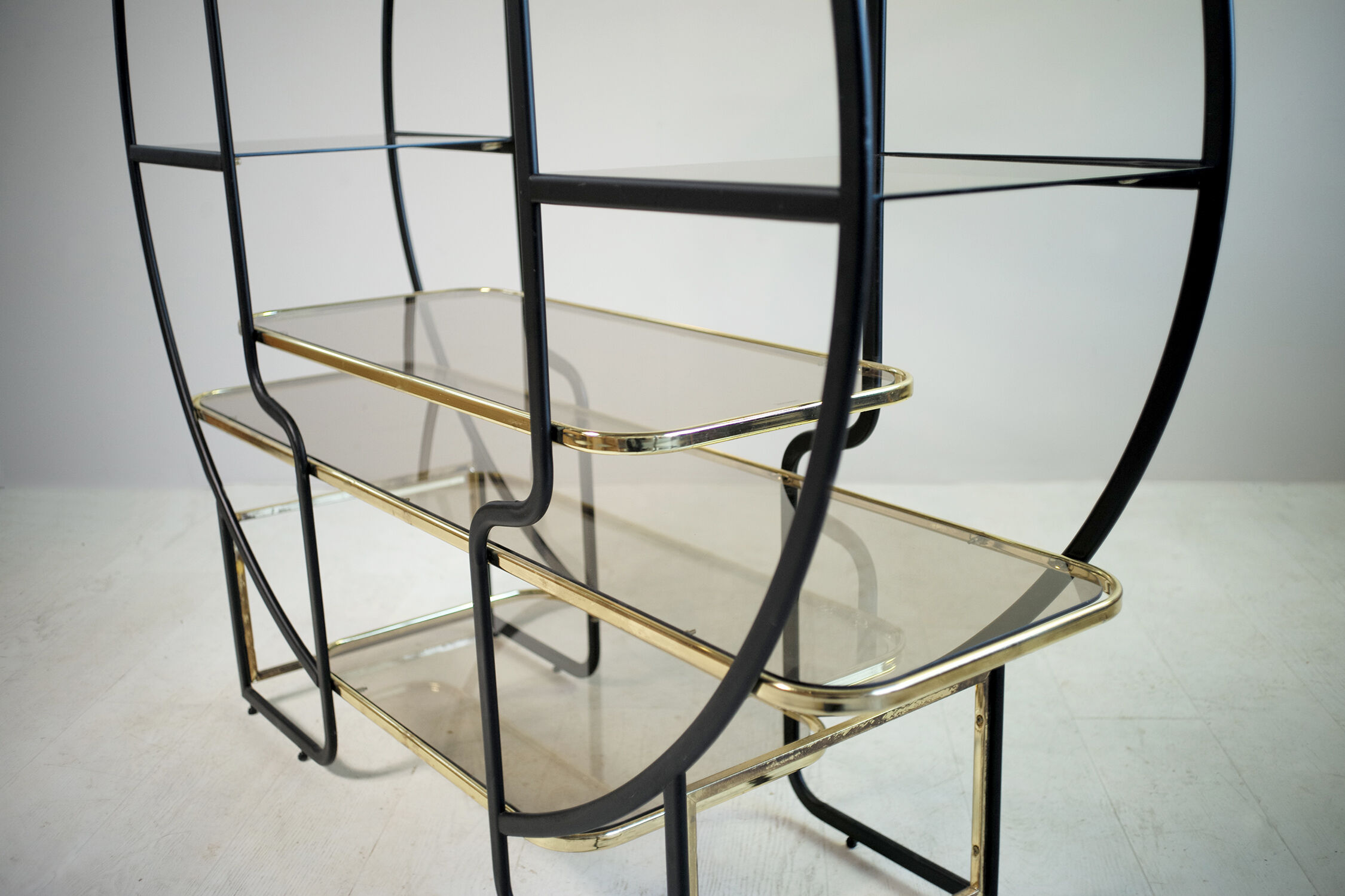 "Circle" library in black anodized metal and golden brass, 1970
