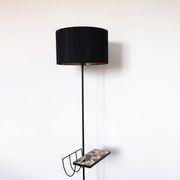 Black metal magazine rack floor lamp with ceramic shelf
