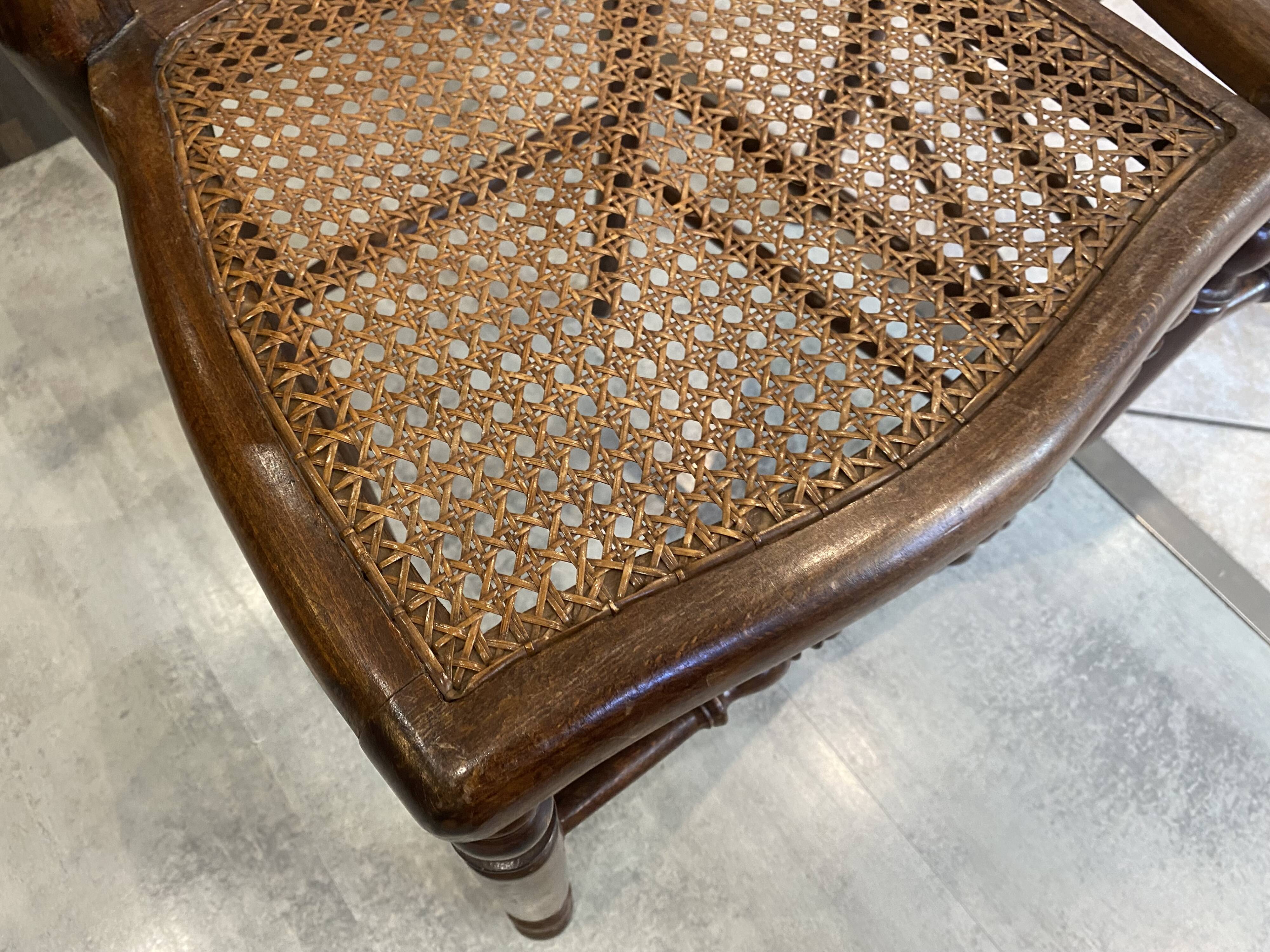 Pair of N2 antique caned and wooden chairs from the 1900s.