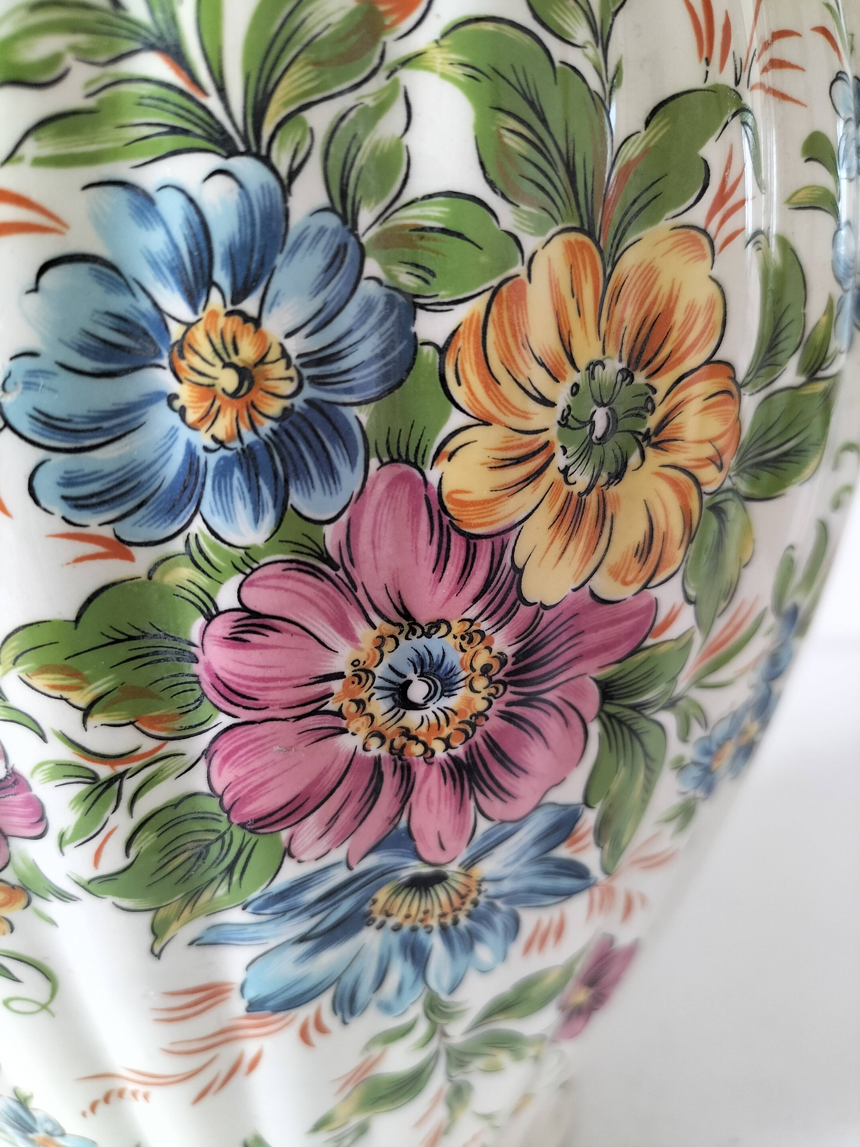 Antique vase with floral decoration in enamelled earthenware – timeless charm