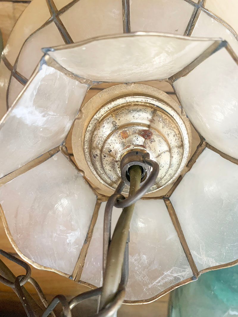 Mother-of-pearl and brass suspension