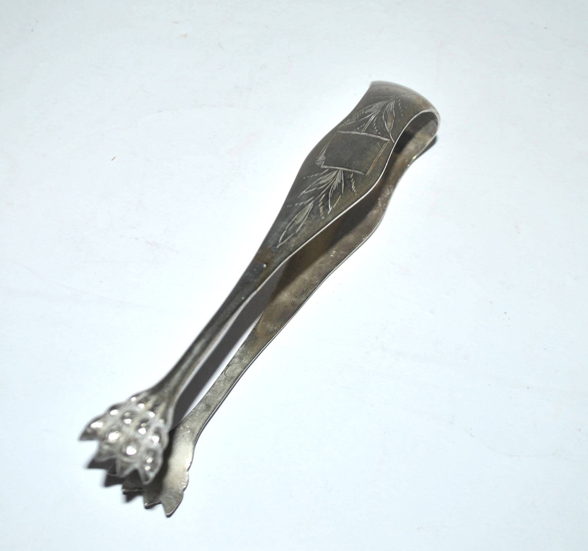 Vintage engraved silver metal lion claw sugar tongs