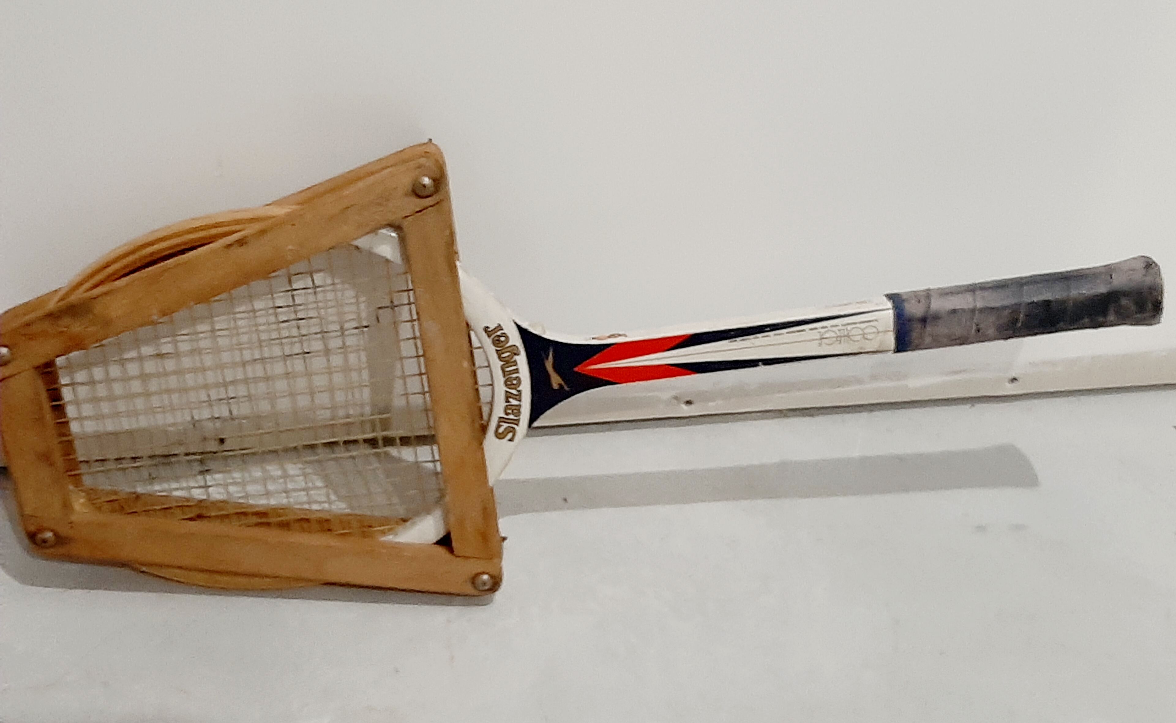 Vintage tennis racket slazenger and its wood frame